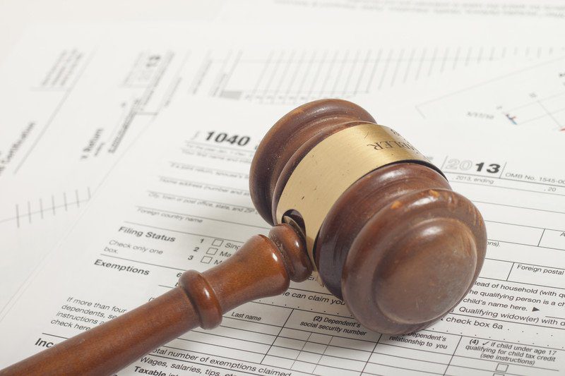 gavel on tax paperwork